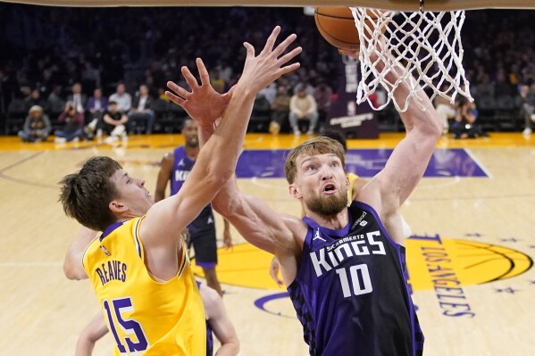 Kings overcome LeBron s triple double hold on in 4th quarter for